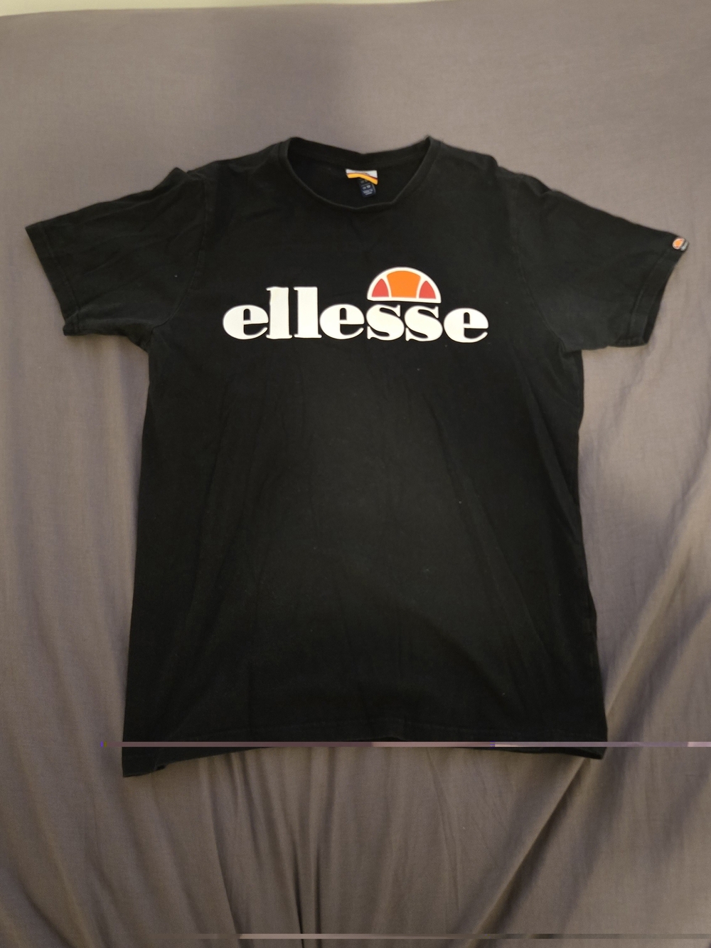 Ellesse Black Tee with White Logo and Orange Accent